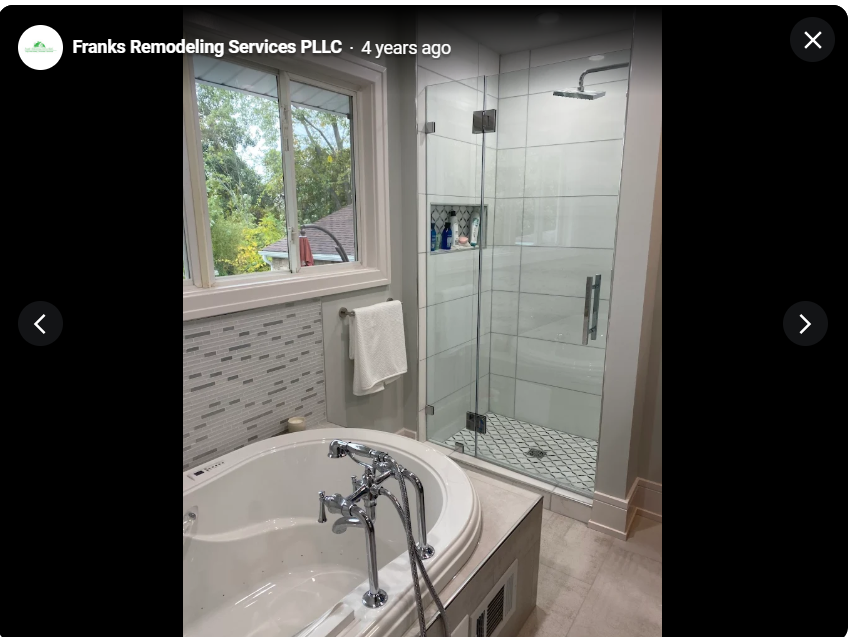 Remodeled bathroom with a glass shower and freestanding tub