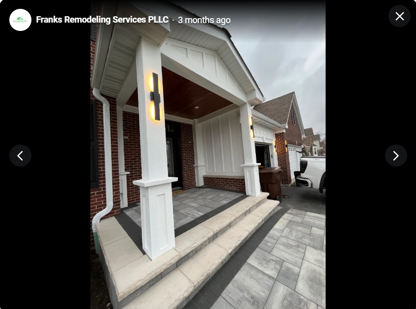Renovated front porch with white columns and paver walkway